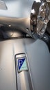 Vespa text sign and brand logo silver chrome on italian moped front of grey gts