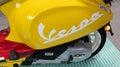 Vespa text sign on side panel with brand logo on new modern retro style of scooter