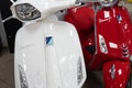 Vespa white red Italian brand text and logo sign front of scooter italian modern