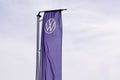 Volkswagen new sign vw logo car brand on flag blue front of vehicle store dealership