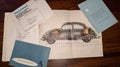 Volkswagen vw logo sign 1950s vintage car flyer service manual and leaflet on retro Royalty Free Stock Photo