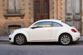 Vw beetle new volkswagen white car parked in the street