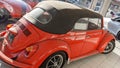 Vw 1500 Volkswagen coral Beetle red convertible rear view vintage car parked under the