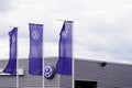 vw volkswagen new sign and logo car on flag front of automobiles store dealership