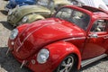 Vw Volkswagen red Beetle ancient vintage car line bug in show exhibition outdoor