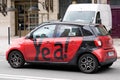 Yea! smart text and logo sign on side of city rent car sharing concept vehicles in big