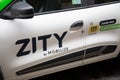 zity mobilize on ev dacia spring electric car for rental sign logo and brand text