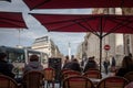 Selective blur on clients sitting at the terrace of a French brasserie, or cafe,