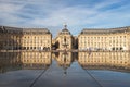 Bordeaux France 08.25.2014: Place de la Bourse with reflecting pool with people and building in reflection Royalty Free Stock Photo