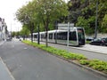 Bordeaux, Gironde France Moving tram next to Place de la Bourse and Le Miroir d`eau Water Mirror in Bordeaux