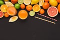 Variety of ripe citruses on black background Royalty Free Stock Photo