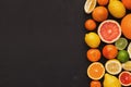 Variety of ripe citruses on black background Royalty Free Stock Photo