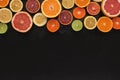 Variety of ripe citruses on black background Royalty Free Stock Photo