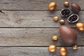 Border of chocolate easter eggs on wooden background Royalty Free Stock Photo