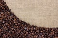 Border of coffee beans on the old burlap Royalty Free Stock Photo