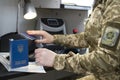 Border Control. The process of scanning a ukrainian passport document while checking the documents on the eastern border of the EU