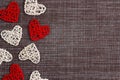 Border of decorative hearts on sackcloth background. Space for text. Valentine`s day concept Royalty Free Stock Photo