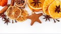 Border of dried oranges, lemons, mandarins, star anise, cinnamon sticks and gingerbread, isolated on white Royalty Free Stock Photo