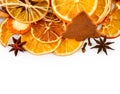 Border of dried oranges, lemons, mandarins, star anise, cinnamon sticks and gingerbread, isolated on white Royalty Free Stock Photo