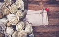 Border of dry white roses, stack of old postcards Royalty Free Stock Photo
