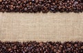 Border frame of coffee beans on the old burlap Royalty Free Stock Photo