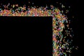 Border frame of colorful sprinkles on a black background with co Royalty Free Stock Photo