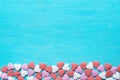 Border Frame from Colorful Sugar Sprinkles Candies Scattered on Light Blue Background. Valentine Romantic Birthday Charity Royalty Free Stock Photo