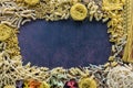 A border frame made up of dry pasta shapes with copy space in the middle. Royalty Free Stock Photo