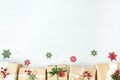 Border of gift boxes wrapped in kraft paper on white wood desk background