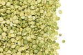 Border of green dry purified peas closeup with copy space on white background. Royalty Free Stock Photo