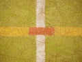 Hairy carpet on outside hanball playground. Floor of sports court with white marking lines. Royalty Free Stock Photo