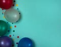 The border is made of colored balloons and confetti on a light blue background. Royalty Free Stock Photo