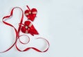The border is made of hand-sewn decorative red hearts with ribbons and lace on a white background. Royalty Free Stock Photo