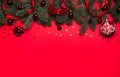 The border is made of spruce branches, red balls, stars, ribbons and bells on a red background. Christmas, Royalty Free Stock Photo