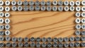 Border of metal washers on wooden surface Royalty Free Stock Photo