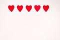 Border of paper red hearts on a white background. Birthday card with copy space for Valentine`s Royalty Free Stock Photo
