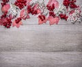 Border with red maple leaves, viburnum berries and autumn scenery on grey wooden rustic background top view close up with text are