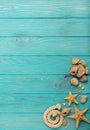 Border with rope, stones, sea shells and starfish on a turquoise Royalty Free Stock Photo