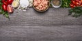 Border with shrimp with spices and vegetables and herbs on wooden background top view Banner for website