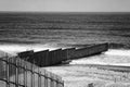 This is the border wall between USA and Mexico; that`s the USA militarized side, on the other side, the beach and the restaurants Royalty Free Stock Photo