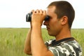 A border war is looking through binoculars Royalty Free Stock Photo