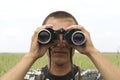 A border war is looking through binoculars Royalty Free Stock Photo
