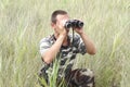 A border war is looking through binoculars Royalty Free Stock Photo