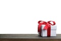 Border with white gift box with red ribbon bow Royalty Free Stock Photo