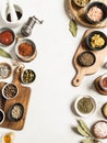 Borders of various dry spices and sauces on a light background. Flat lay of small bowls with dijon mustard, olive oil, ketchup, Royalty Free Stock Photo