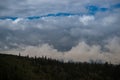 Boreal Forest Silhouette under Cloud Layers Royalty Free Stock Photo