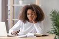 Bored african american teen student tired of learning doing homework Royalty Free Stock Photo