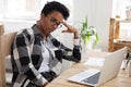 Bored african american woman tired from computer work or study