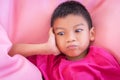Bored Boy lying unhappy expression face for childhood frustration and anger concept Royalty Free Stock Photo