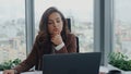 Bored business woman sitting desk with laptop in office closeup. Lady thinking Royalty Free Stock Photo